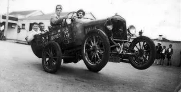 Trick car travelling on rear wheels Image: Trick car travelling on rear wheels