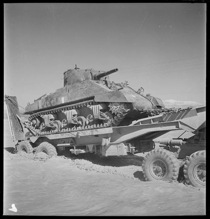 Sherman tank being transported across a flooded stream, Tunisia - Photograph taken by M D Elias