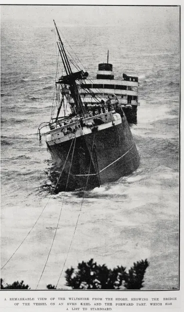 Image: A remarkable view of the Wiltshire from the shore, showing the bridge of the vessel on an even keel and the forward part, which has a list to starboard