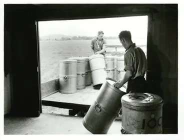 Image: Twenty gallon cans of milk being loaded from the farm dairy for delivery to the cheese factory