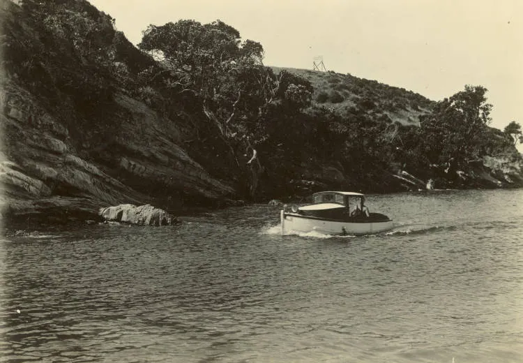 Small launch entering Wairau Estuary, Milford Beach.