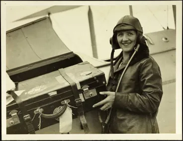 Audrey Mill loading suitcase into Moth G-NZAT. Image: Audrey Mill loading suitcase into Moth G-NZAT.