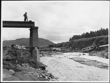 Image: Photographer on destroyed railway bridge at Tangiwai, after railway disaster