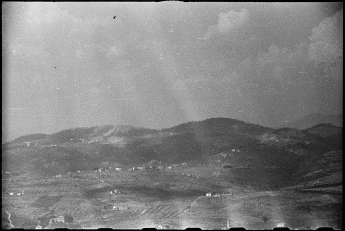 Shells from New Zealand guns bursting on San Maria as the Division advances to Florence, Italy, World War II - Photograph taken by George Kaye