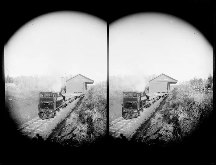 Railways F class steam locomotive, F 47, loaded with planks towing a small goods shed, unknown location