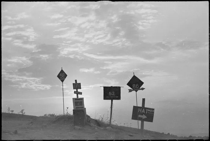 Diamond sign of the New Zealand Division silhouetted against sky near Rimini, Italy, World War II - Photograph taken by George Kaye