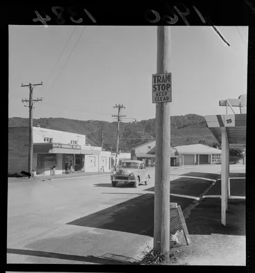 Image: Wainuiomata street scene with a tramstop sign and Bradbrury's Fish Supply shop, Lower Hutt, Wellington Region