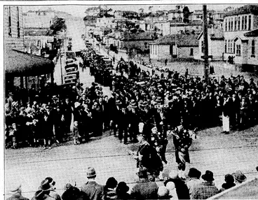 Image: Evening Post" Photo.' NEWTOWN SCHOOL JUBILEE.-—Procession of ex-pupils who took part in the jubilee celebrations of the Newtown Primary School on Saturday on the way to the Winter Show building, in John -Street, wherethe afternoon' functions were held. The Newtown School is seen in the right background.. , (Evening Post, 01 October 1934)