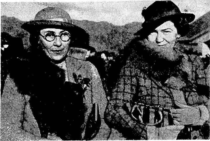 Evening Post" Photo. Miss Mabel Perry (left) and Mrs. John Duncan at yesterday's race meeting. Miss Perry is wearing grey tweeds_ flecked with white, and Mrs. Duncan a jacket of autumnal shaded plaid with a plain brierwood brown skirt. (Evening Post, 10 July 1940)