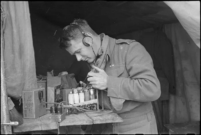 A J Murphy testing wireless set on the Cassino Front in Italy, World War II - Photograph taken by George Kaye