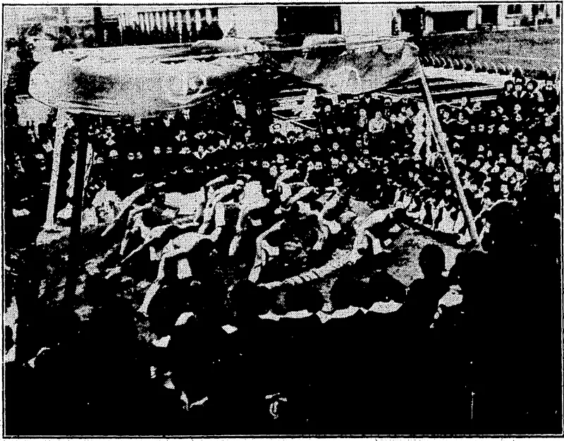 JAPANESE SCHOOLBOY WRESTLERS- – ■ The opening ceremony in the wrestling arena in. the compound of the primfryschool ittlcLa ighef Kormal;Schoo1' in tb* wtapfS? KofaStoS Scholars of the-school and parents are watching proceeding? (Evening Post, 28 March 1935)