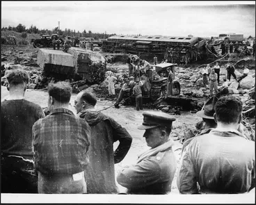 Image: Men on the banks of the Whangaehu Stream at the scene of the railway disaster at Tangiwai