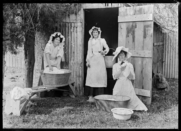 Three women, with tin tubs and buckets