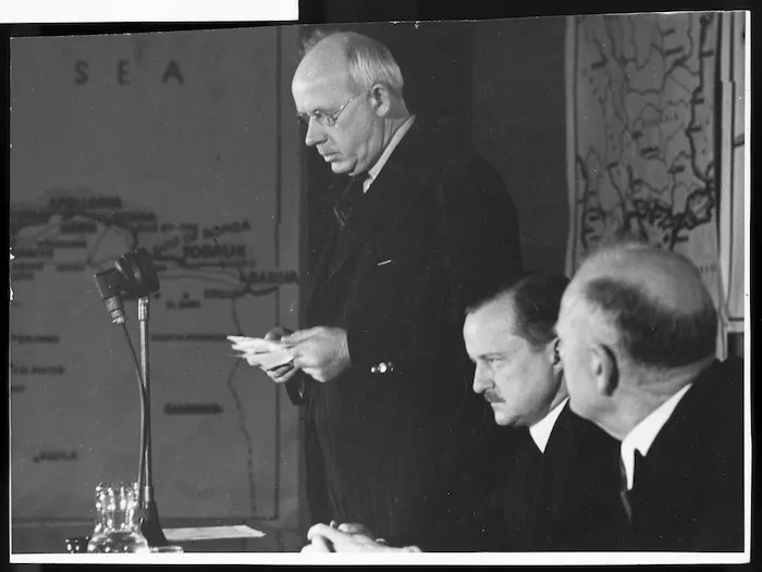 Peter Fraser reading into a microphone during World War II - Photograph taken by Fox Photos Ltd