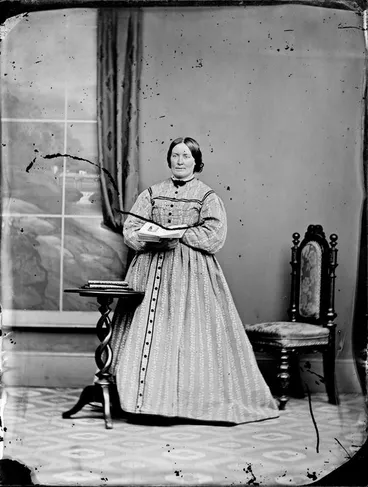 Image: Unidentified woman, with an open book