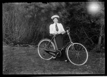 Image: Woman with bicycle.