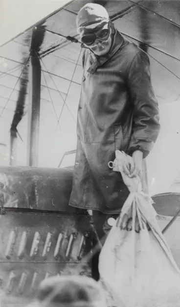 George Bolt loading the first airmail bag on flight to Dargaville Image: George Bolt loading the first airmail bag on flight to Dargaville