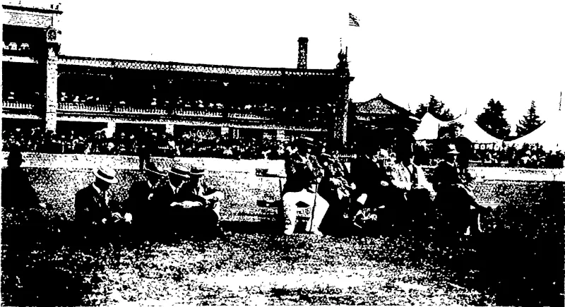 1) Competitors passing the grandstand xn the halt-mile u> A competitor jfter emeigirg from the back in the obstacle race (5) \V L. Colvin (fih yards) wins the Caledonian handicap,  THE JUDGES OF THE HIGHLAND DANCING AND BAGPIPE MUSIC,  (At the back of the seat the officer m charge of the Pioneer squad.; (Otago Witness, 09 January 1907)