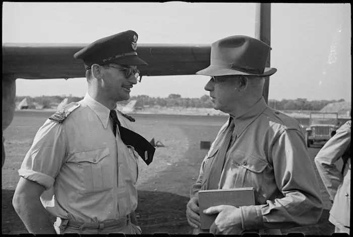 Prime Minister Peter Fraser talking with Mrs Knox Gilmour's son in law at Bari Airport, Italy, World War II - Photograph taken by George Bull