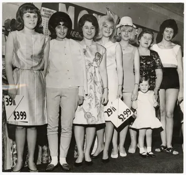 Image: Models holding decimal price tags, Woolworths