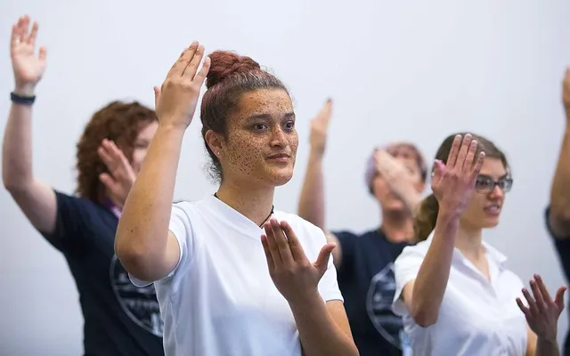 Students from Van Asch Deaf Education Centre perform national anthem