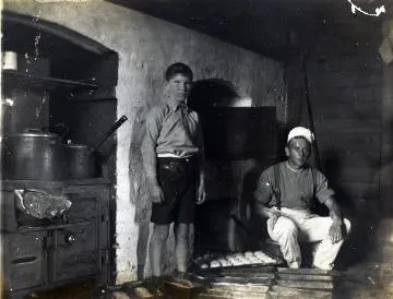 Man and boy in a cookhouse : digital image