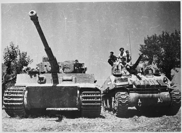 Image: New Zealand Sherman tank alonside a German Tiger tank in La Romola, Italy, World War II - Photograph taken by George Kaye