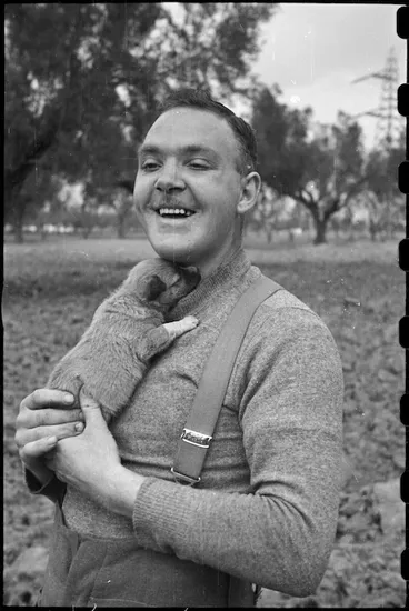 Image: Private E R Hiscoke and puppy mascot Ace at the NZ Reinforcement Transit Unit, Italy, World War II - Photograph taken by George Bull