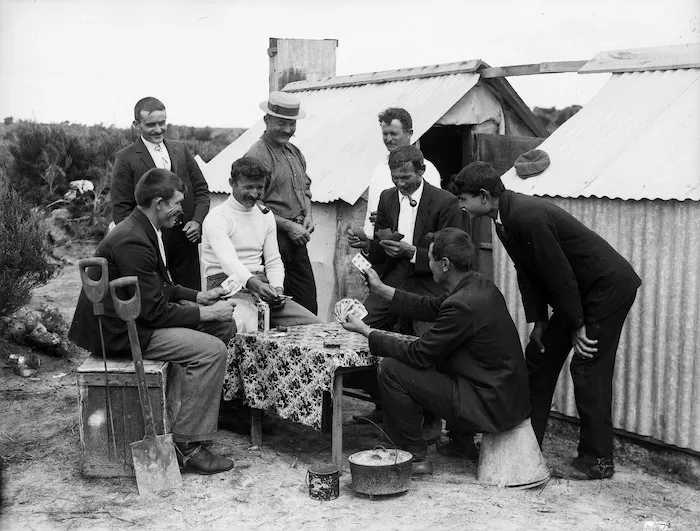 Gum diggers playing cards in camp