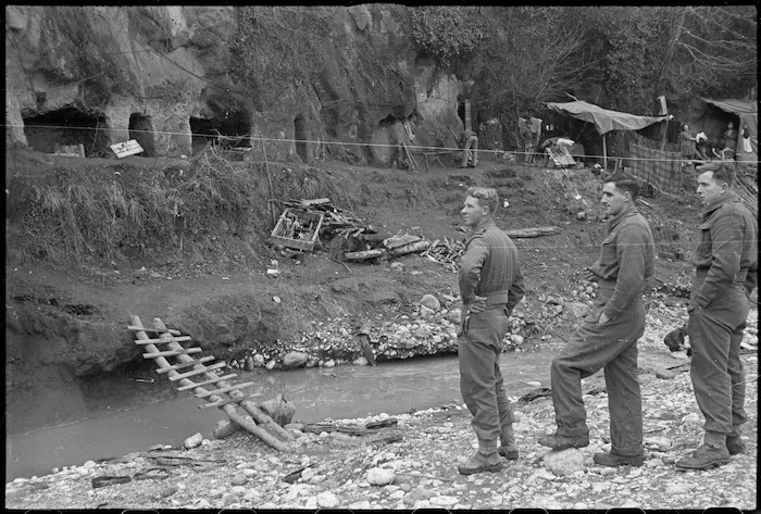 New Zealand soldiers surveying caves used as living quarters by Cassino civilians, Italy, during World War 2