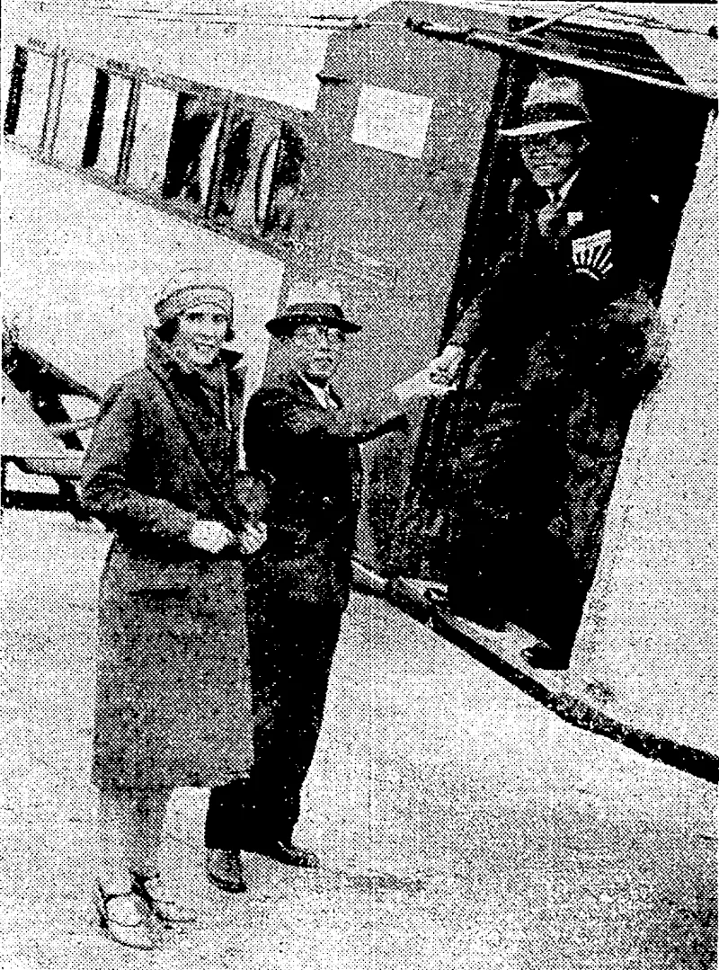 Sport and General" I'lioio." WORLD-TRAVELLERS MEEK—Mr.-X. Fukuma (on ground) and Mr. S. Shingu,. two: Japanese journalists, meeting at Croydon aerodrome.on-25th June, during their separate flights- round the ivorld, but travelling in opposite'directions. With .them is Mrs. Victor Bruce, ivho met them at Croydon.- (Evening Post, 18 August 1931)