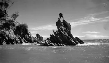Image: Man standing on a rock formation at Wainui, Golden Bay