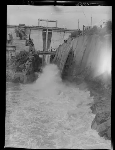 Image: Large crowd of people on the dam and footbridge at the opening of the Whakamaru Hydro Power station, Waikato River