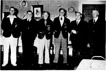 Image: Evening Post" Photo. Australian athletes who are to compete at Wellington tomorrow received a welcome this morning at Parliament House from members of the Government. From the left, MrrH. McCormick, chairman of the New Zealand Olympic and Empire Games Council, the Hon. F. Jones, G. Backhouse, E. Best, the two Victorian athletes, the Hon. F. Langstone. and Mr. A. C: Kitto, president of the Wellington Centre 'of the N.Z.A.A.A. (Evening Post, 06 January 1939)