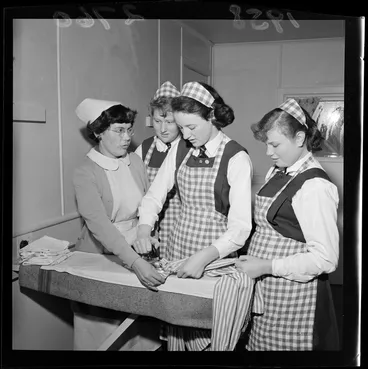 Image: Students at Wellington East Girls' College, being taught how to iron clothing, in a Home Economics class