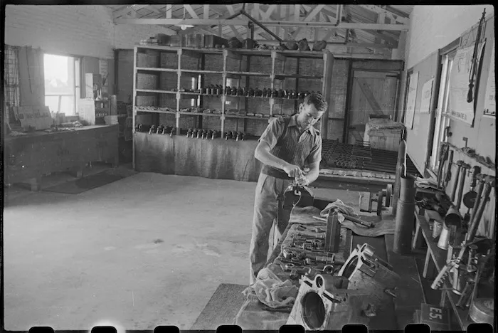 Trooper P J Brown in the armoury of the NZ Armoured Training School at Maadi Camp, Egypt - Photograph taken by George Bull