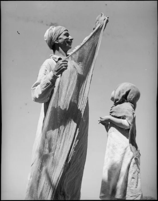 Arab fisherman and child on the Nile River, Egypt - Photograph taken by George Kaye