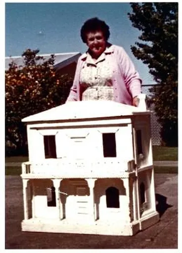 Image: Marjorie Loader with dolls-house: photograph