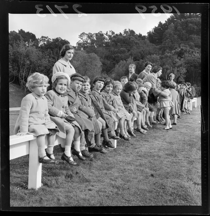 Children and unidentified adults, from Hataitai Kindergarten, at Arbor Day celebration, location unidentified