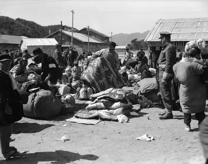 Korean repatriates with loads of their household goods