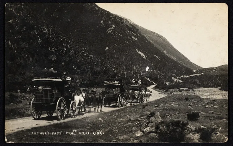 Three stagecoaches on road through Arthur's Pass.