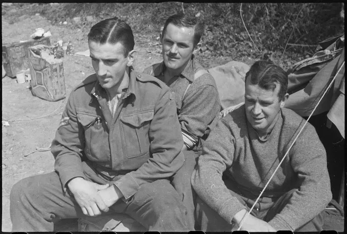 Three New Zealand infantry soldiers rest immediately behind the lines on the Cassino Front, Italy, World War II - Photograph taken by George Kaye