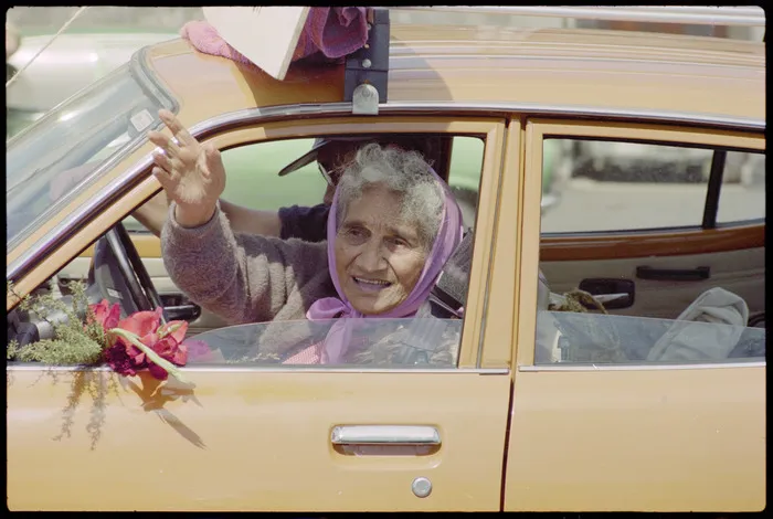 Whina Cooper waving from car