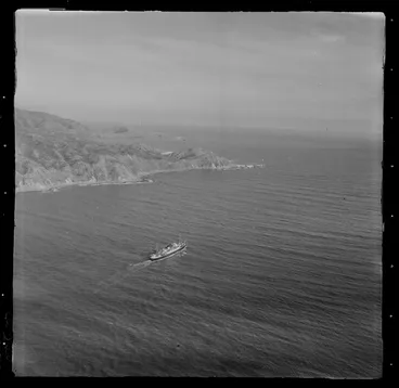 Image: Pencarrow Lighthouses at Pencarrow Head, at the end of Eastbourne Peninsula and the entrance to Wellington Harbour, with a ship leaving port