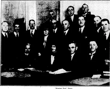 Image: FIRST WOMAN MEMBER ARRIVES AT PARLIAMENT.—Mrs.E. R. McCombs, recently elected to Parliament at the, Lyttelton byelection, and the first woman in New Zealand to be so honoured, took her seat toddy- at the opening of Parliament. On right, Mrs. McCombs is seen' entering Parliament House today with Mr. H. E. Hollanfl,, leader of the Opposition. Above, members of the Parliamentary Labour Party who welcomed. the new member to the House today. Front row, from left, Mr. H. E. Holland, Mrs. McCombs, Mr. M.J. Savage, deputy leader of the Labour Parly, ' Mr. D. W. Coleman (Gisborne). . Standing, Messrs. W. J. Jordan (Manukau), J: A. Lee (Grey Lynn),R. Semple (Wellington East), Mrs. Walter Nash, J. O'Brien (Westland)yW. E. Parry (Auckland Central), A. S. Richards (Roskill), H. G. R. Mason (Auckland Suburbs), F. Jones (Dunedin South).' At back, Messrs. J. Howard (Christchurch South), the Rev. C. L. Carr (Timaru), J. W.Munro (Dunedin North). (Evening Post, 21 September 1933)