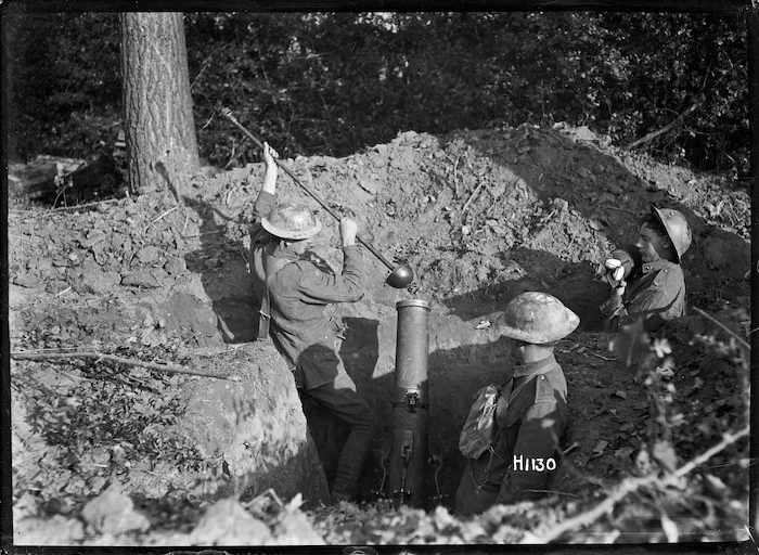 Three New Zealand soldiers using a trench mortar in Le Quesnoy, France, during World War I