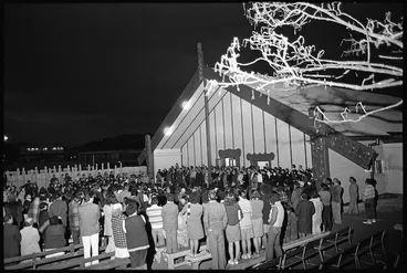 Image: Crowd gathered around the meeting house at the dawn opening of Pipitea Marae, Thorndon Quay, Wellington