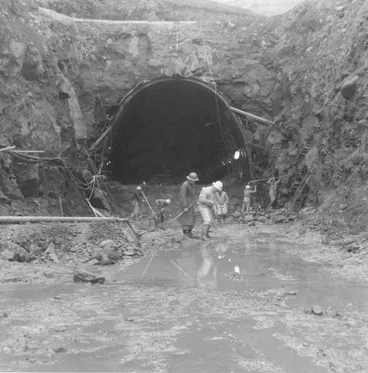 Image: Fletcher Construction Co Ltd, Civil Engineering Division - Christchurch-Lyttelton Road Tunnel: 1961 Men working in entrance of tunnel