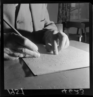 Image: Proof reading Braille sheets for book