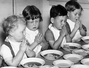 Image: Children saying grace before eating